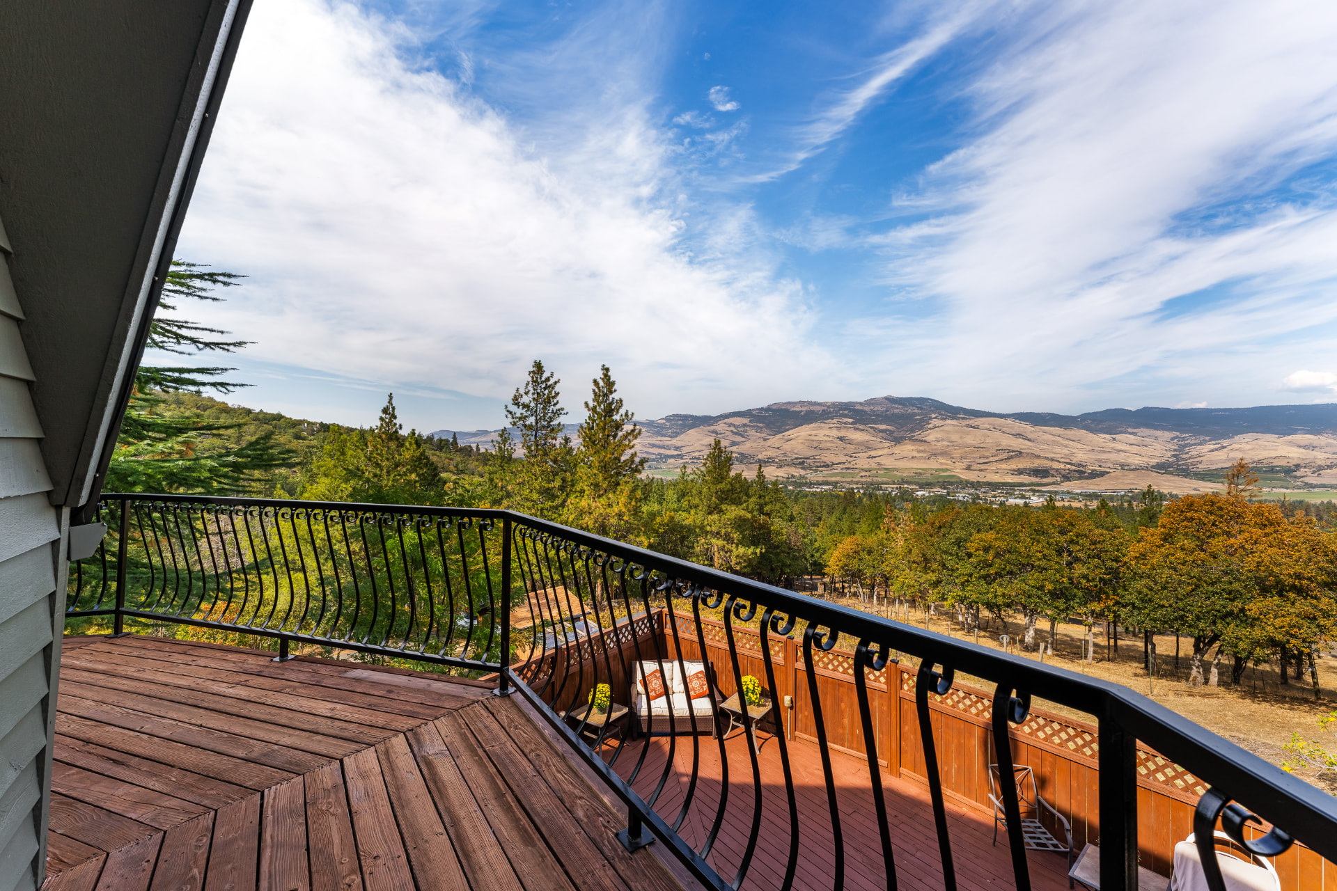 Wraparound deck with a broad view across the valley and mountains